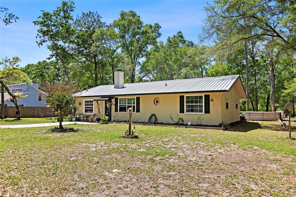 5420 East Gwendolyn Path Inverness, FL 34452 - Photo 2 of 42 a house that has a tree in front of it
