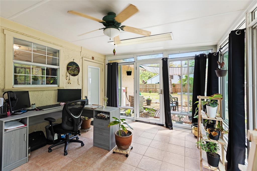 5420 East Gwendolyn Path Inverness, FL 34452 - Photo 27 of 42 a view of a livingroom with workspace and a window