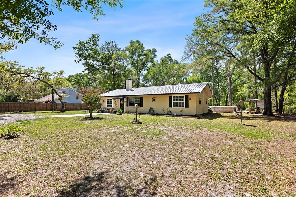 5420 East Gwendolyn Path Inverness, FL 34452 - Photo 3 of 42 a front view of a house with a garden