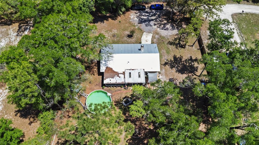 5420 East Gwendolyn Path Inverness, FL 34452 - Photo 38 of 42 an aerial view of a house with a yard fountain and large tree
