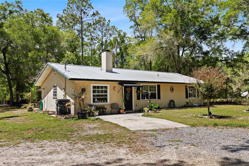 5420 East Gwendolyn Path Inverness, FL 34452 - Photo 4 of 42 a view of a house with backyard and trees