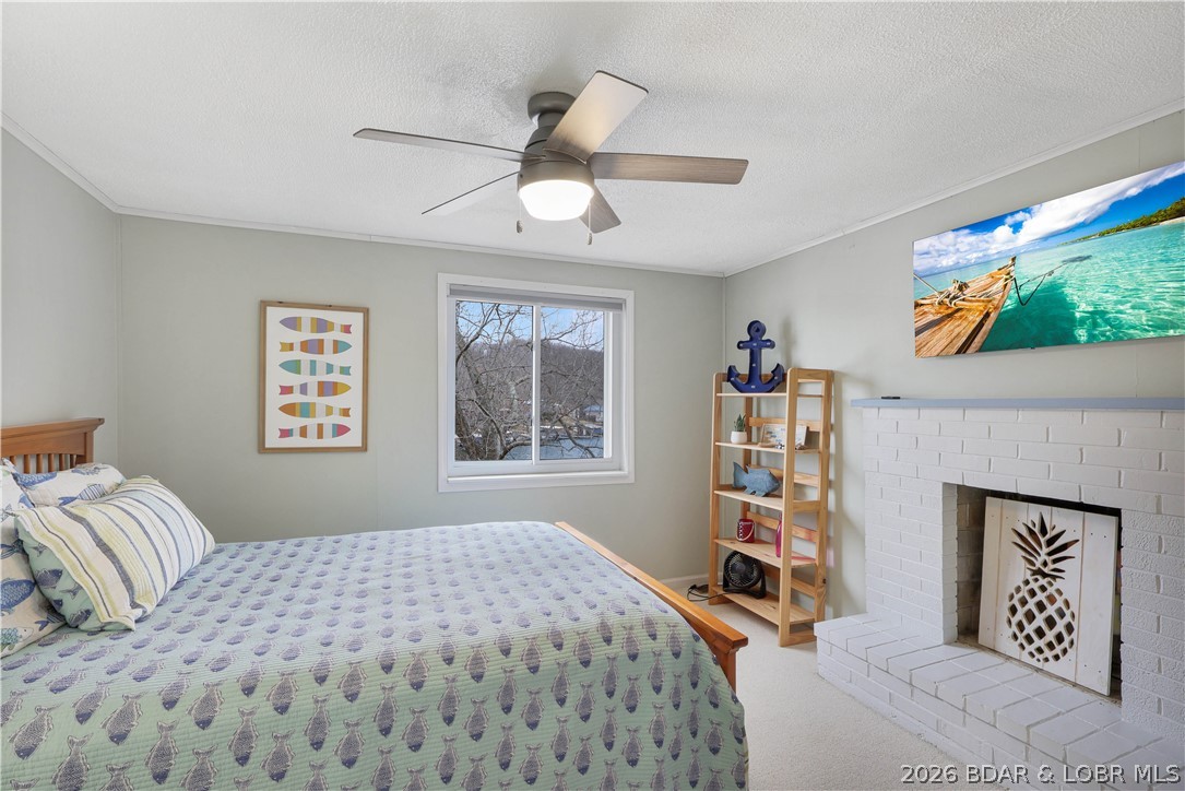 29966 Oak Knoll Road Rocky Mount, MO 65072 - Photo 29 of 59 Bedroom #3 features an inviting fireplace.
