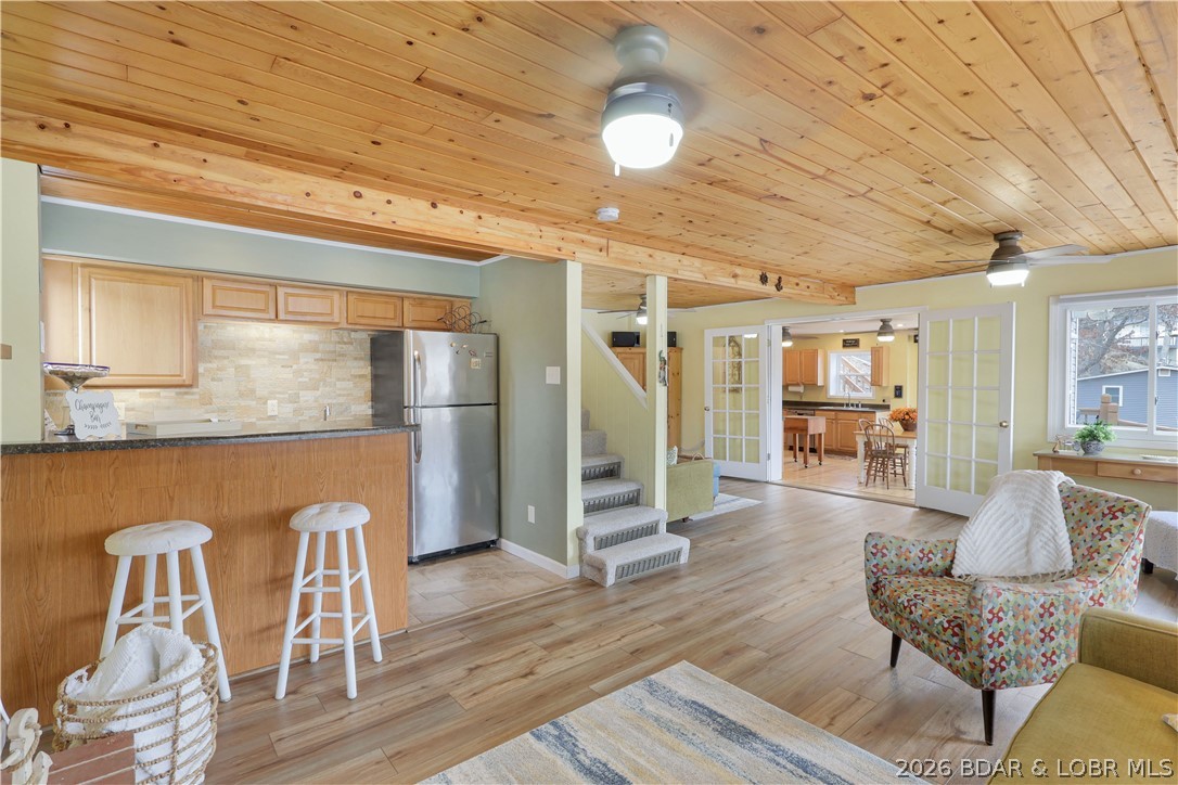 29966 Oak Knoll Road Rocky Mount, MO 65072 - Photo 5 of 59 Living room features a prominent natural wood plan
