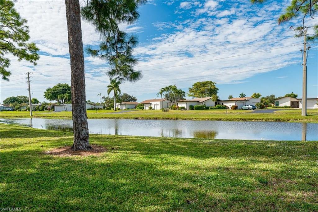 2009 Pine Isle Lane, Unit 2009 Naples, FL 34112 - Photo 16 of 33 a view of a city with lawn chairs and a lawn chair
