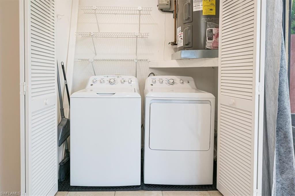 2009 Pine Isle Lane, Unit 2009 Naples, FL 34112 - Photo 19 of 33 a utility room with dryer and washer