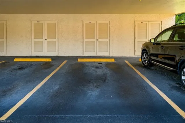 a sign that is sitting on a lush green field