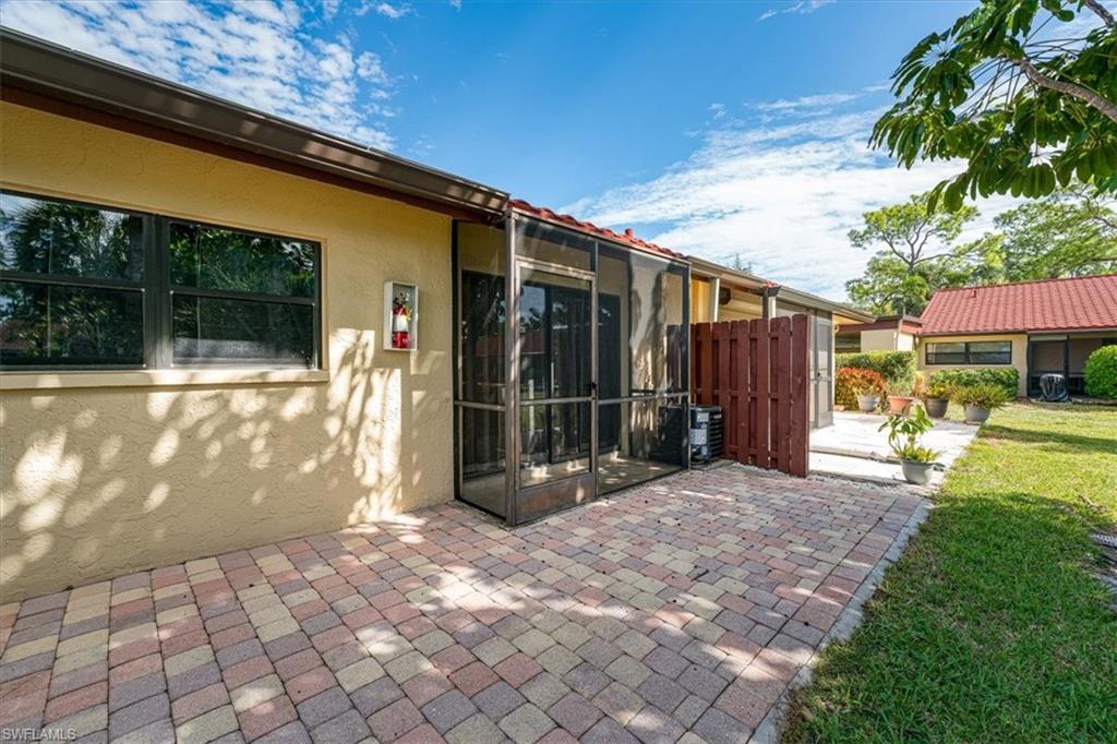 2009 Pine Isle Lane, Unit 2009 Naples, FL 34112 - Photo 2 of 33 a view of a back yard of the house