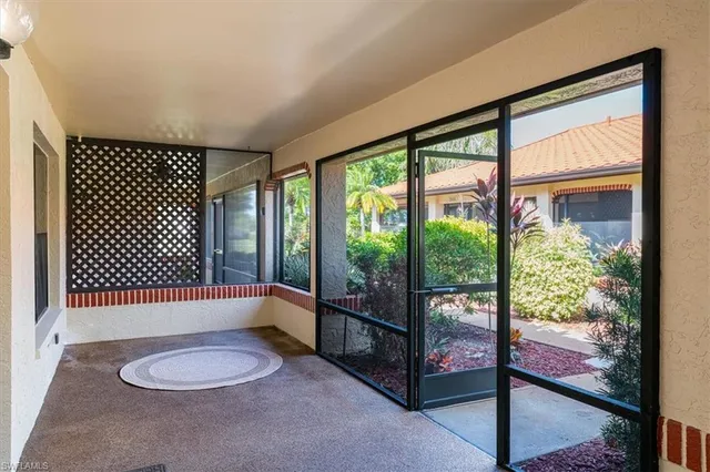 a view of a door and a window