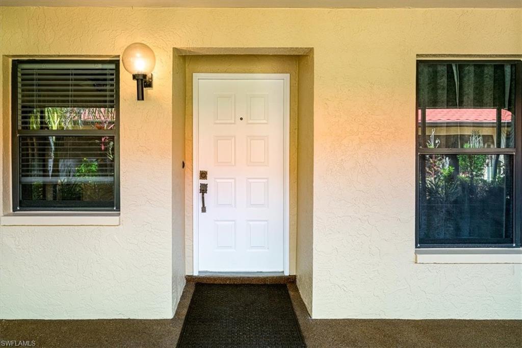 2009 Pine Isle Lane, Unit 2009 Naples, FL 34112 - Photo 24 of 33 a view of a door and a window