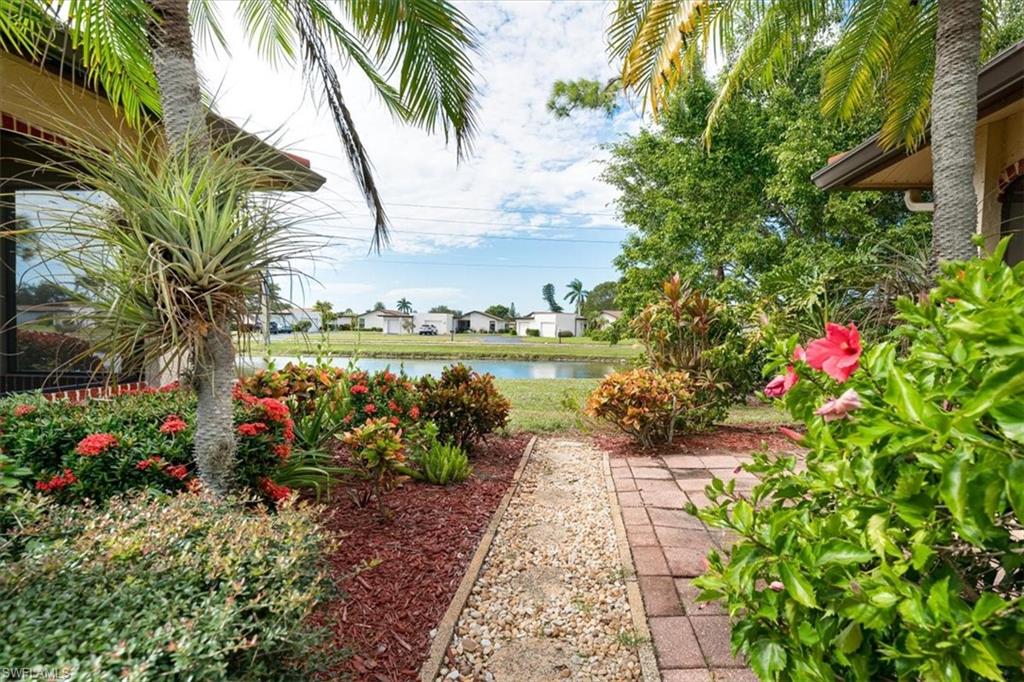 2009 Pine Isle Lane, Unit 2009 Naples, FL 34112 - Photo 26 of 33 a view of a garden with a flower garden