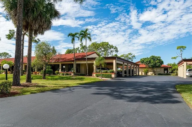 a view of a backyard patio and swimming pool