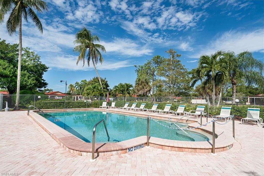 2009 Pine Isle Lane, Unit 2009 Naples, FL 34112 - Photo 28 of 33 a view of a backyard patio and swimming pool