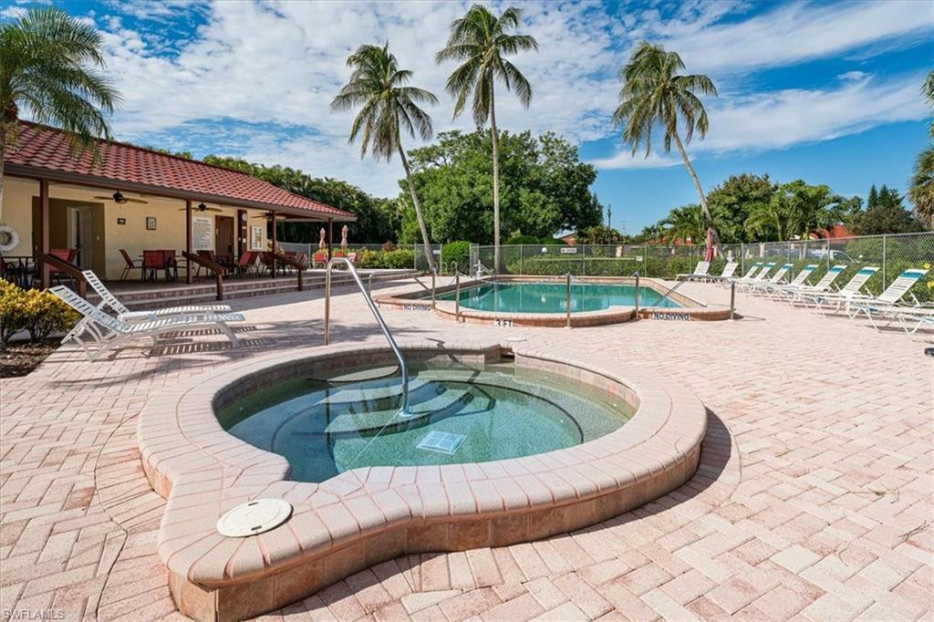 2009 Pine Isle Lane, Unit 2009 Naples, FL 34112 - Photo 29 of 33 a view of outdoor space yard swimming pool and patio