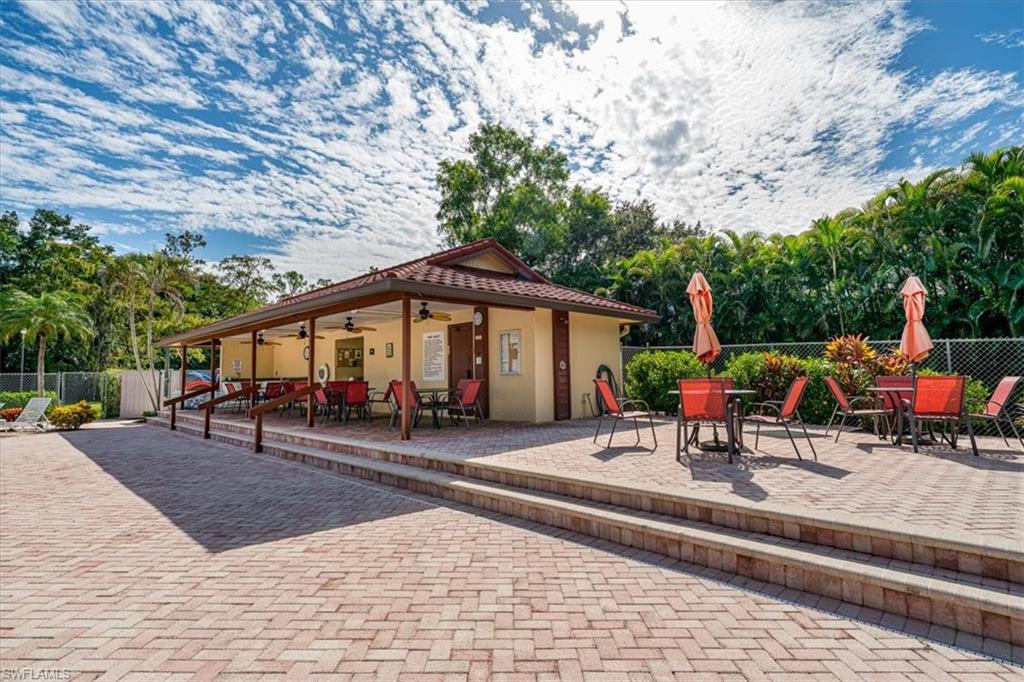 2009 Pine Isle Lane, Unit 2009 Naples, FL 34112 - Photo 30 of 33 a view of outdoor space with seating