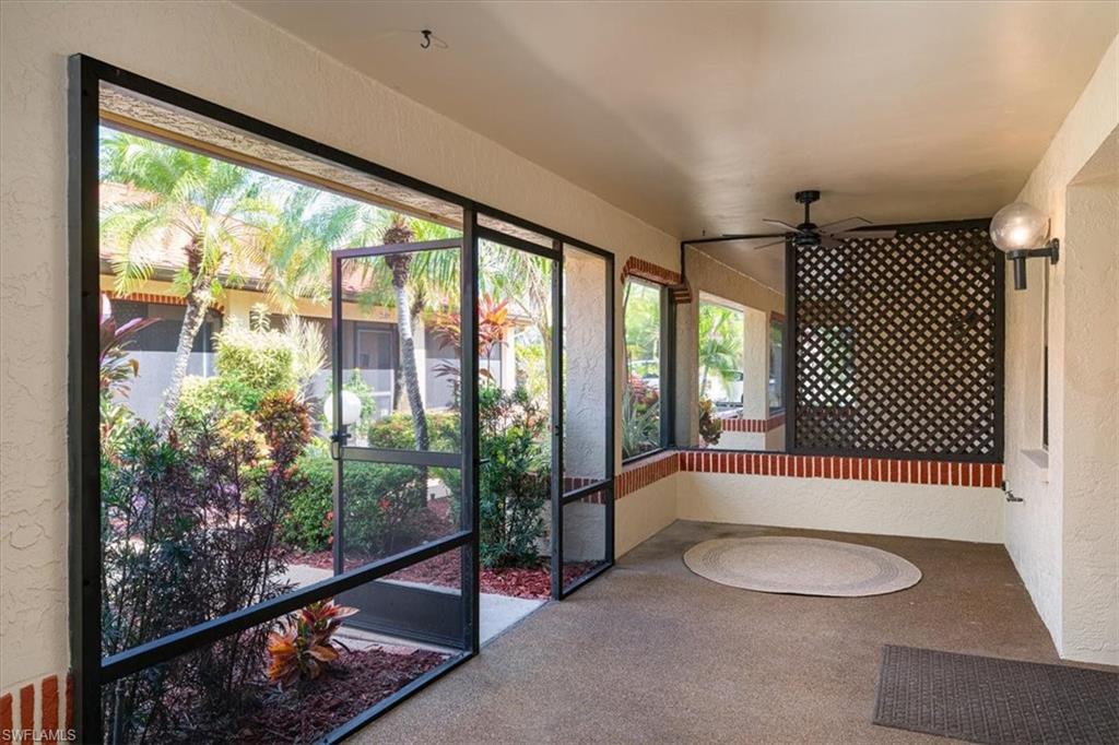2009 Pine Isle Lane, Unit 2009 Naples, FL 34112 - Photo 3 of 33 a bathroom with a sink and mirror