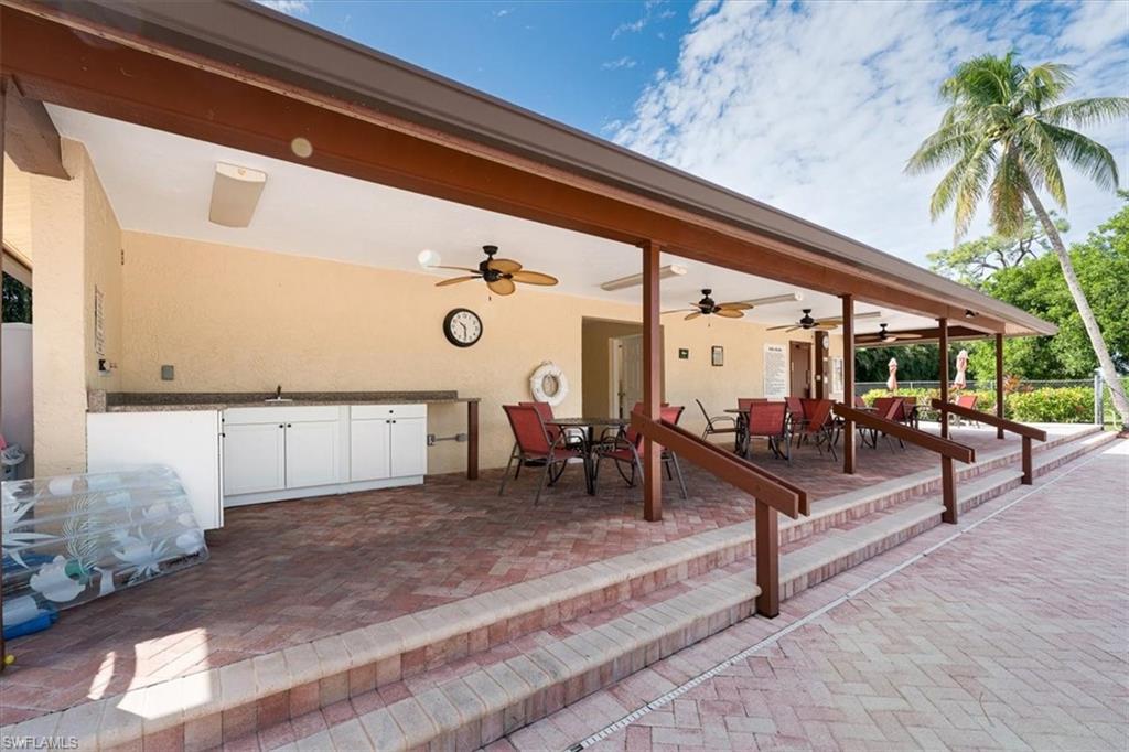 2009 Pine Isle Lane, Unit 2009 Naples, FL 34112 - Photo 31 of 33 a view of a porch with furniture