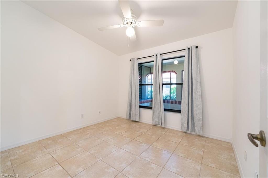 2009 Pine Isle Lane, Unit 2009 Naples, FL 34112 - Photo 9 of 33 a view of an empty room with a window