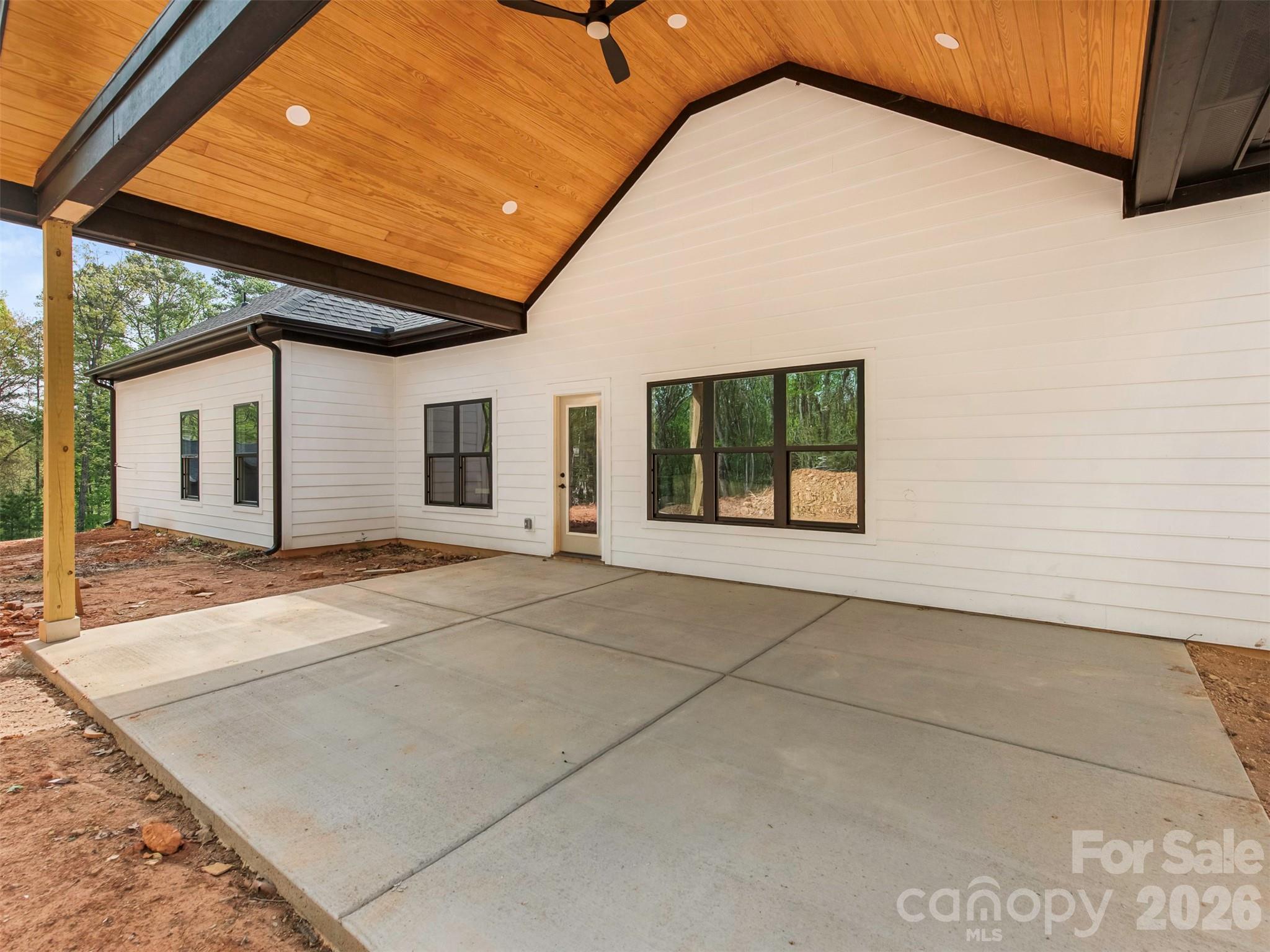 12133 Coyle Road Stanfield, NC 28163 - Photo 36 of 43 a view of a house with a backyard