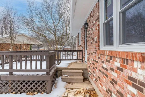 a view of a brick house with a large window