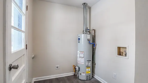 a view of storage and utility room with racks on the wall