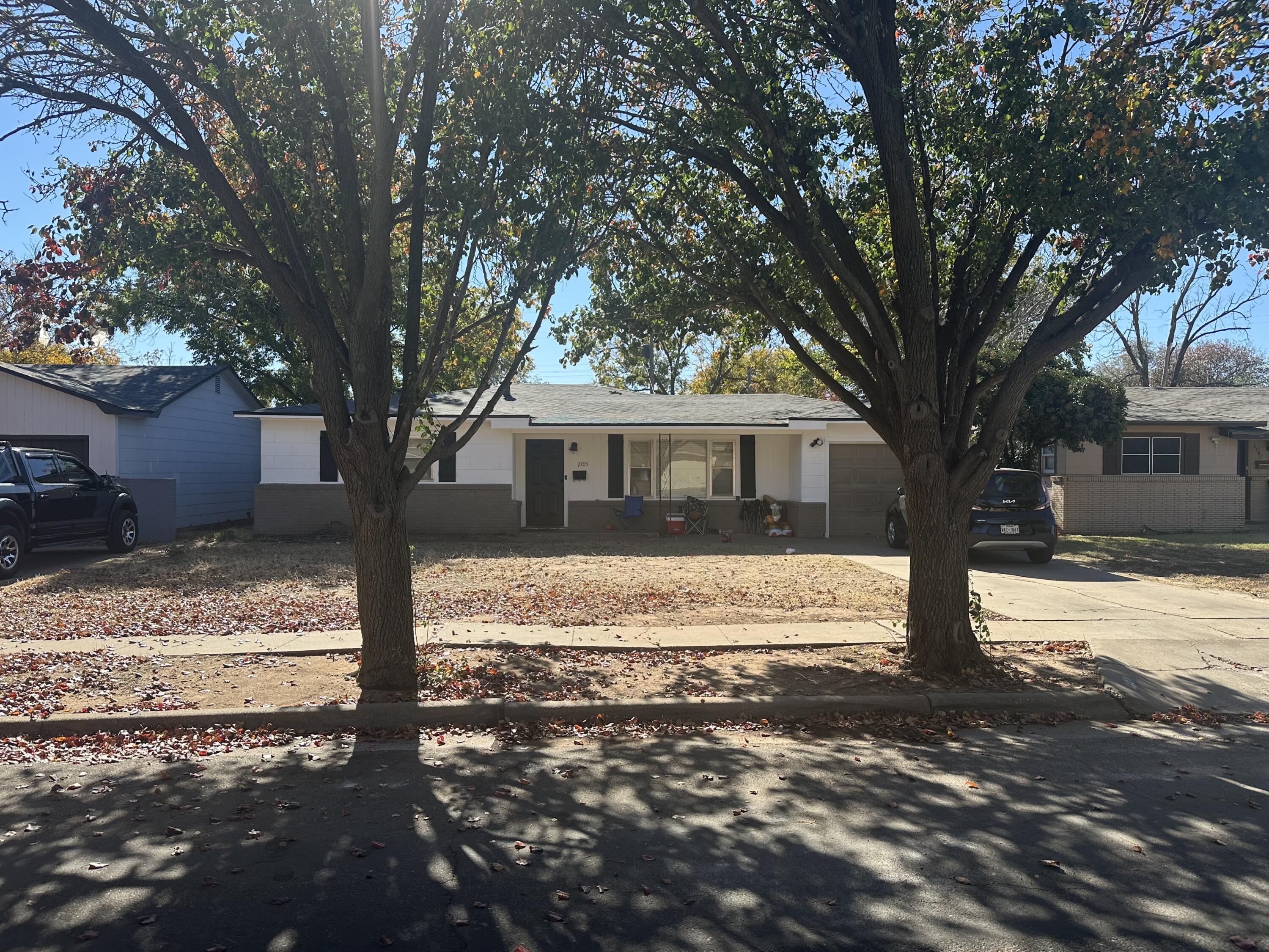 2705 39th Street Lubbock, TX 79413 - Photo 1 of 2 a view of a house with a yard covered in snow