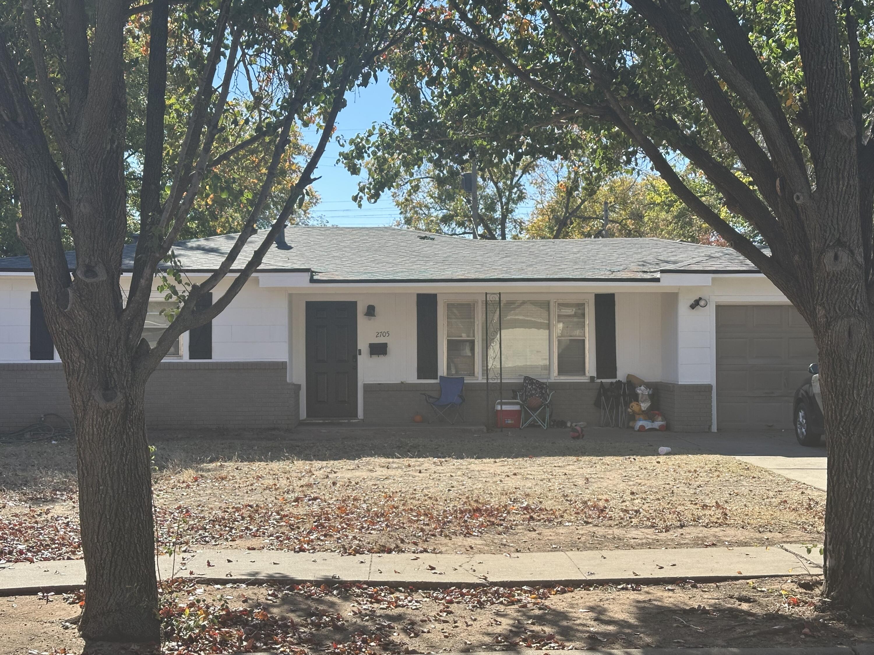 2705 39th Street Lubbock, TX 79413 - Photo 2 of 2 a front view of a house with a yard