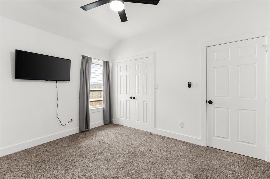 101 Ross Street Sulphur Springs, TX 75482 - Photo 15 of 29 an empty room with ceiling fan and window