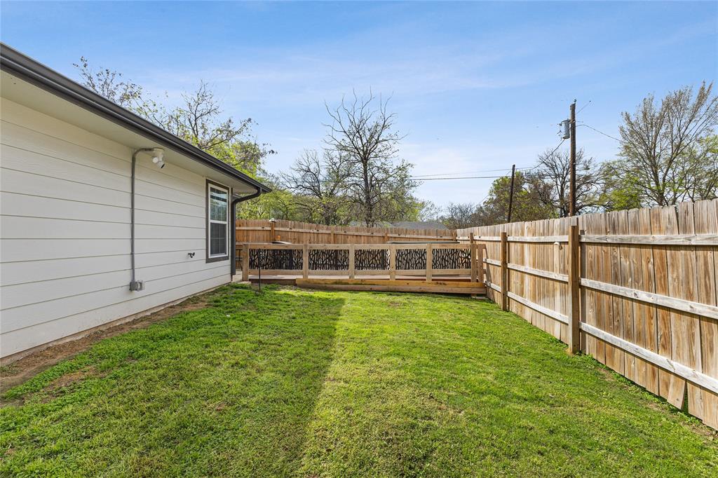 101 Ross Street Sulphur Springs, TX 75482 - Photo 25 of 29 a view of a backyard with potted plants and large tree