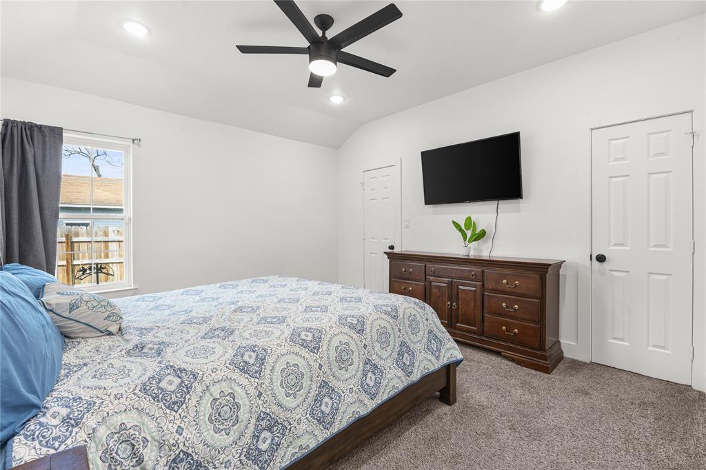 101 Ross Street Sulphur Springs, TX 75482 - Photo 10 of 29 a bedroom with a bed and a flat screen tv