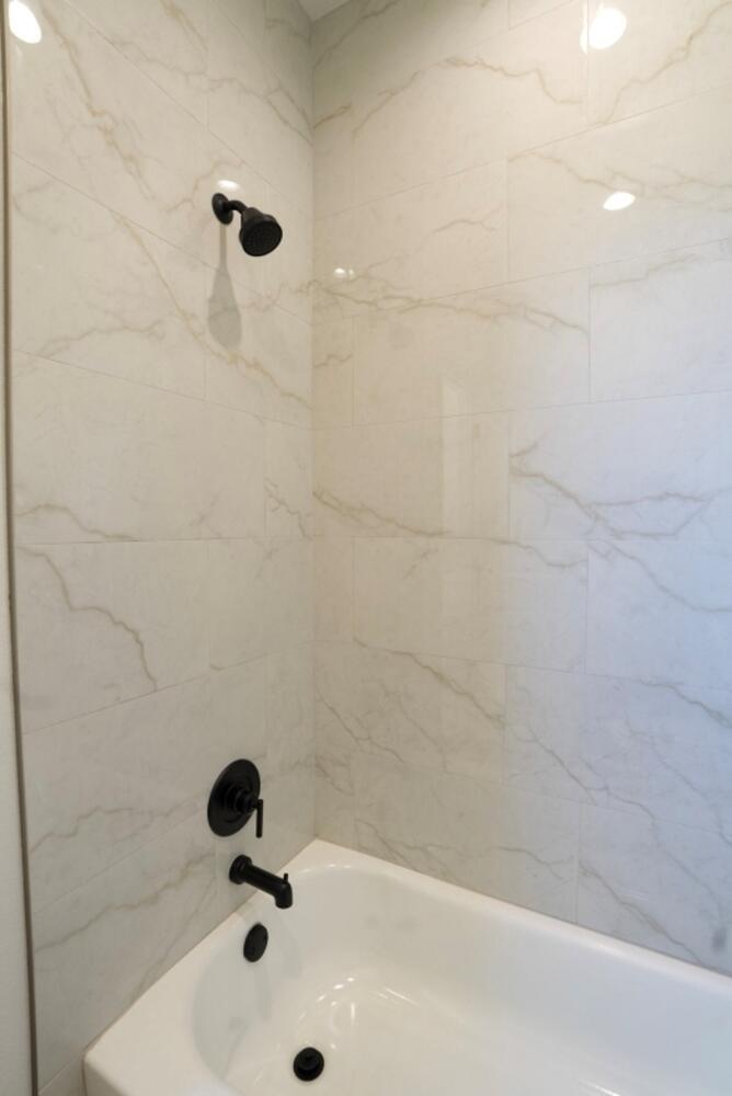4620 143rd Street Lubbock, TX 79424 - Photo 15 of 25 a bathroom with a bathtub
