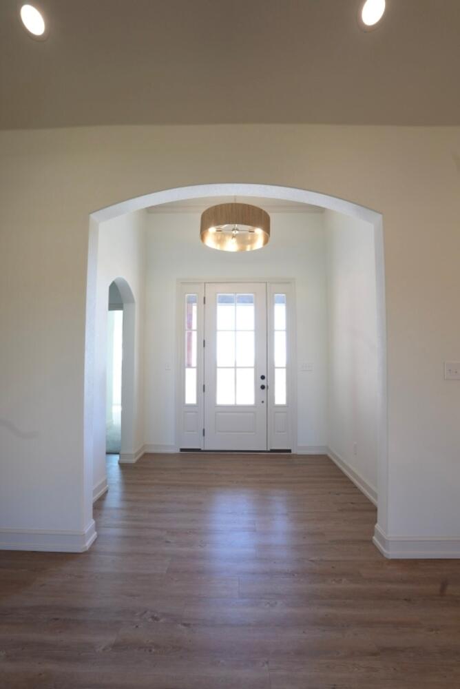 4620 143rd Street Lubbock, TX 79424 - Photo 19 of 25 a view of empty room with wooden floor and fan