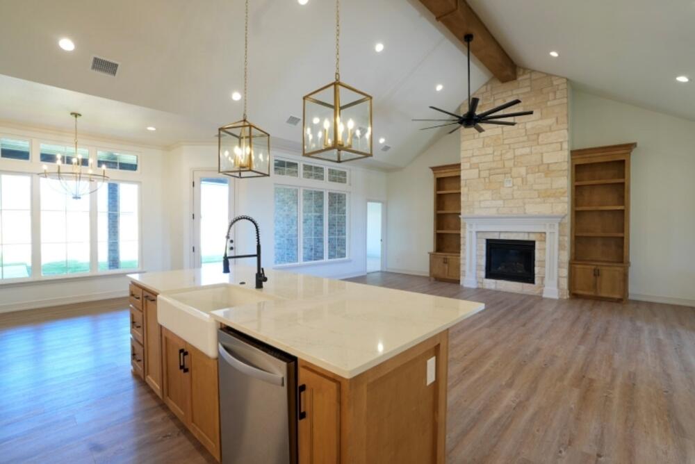 4620 143rd Street Lubbock, TX 79424 - Photo 2 of 25 an open kitchen with sink and cabinets