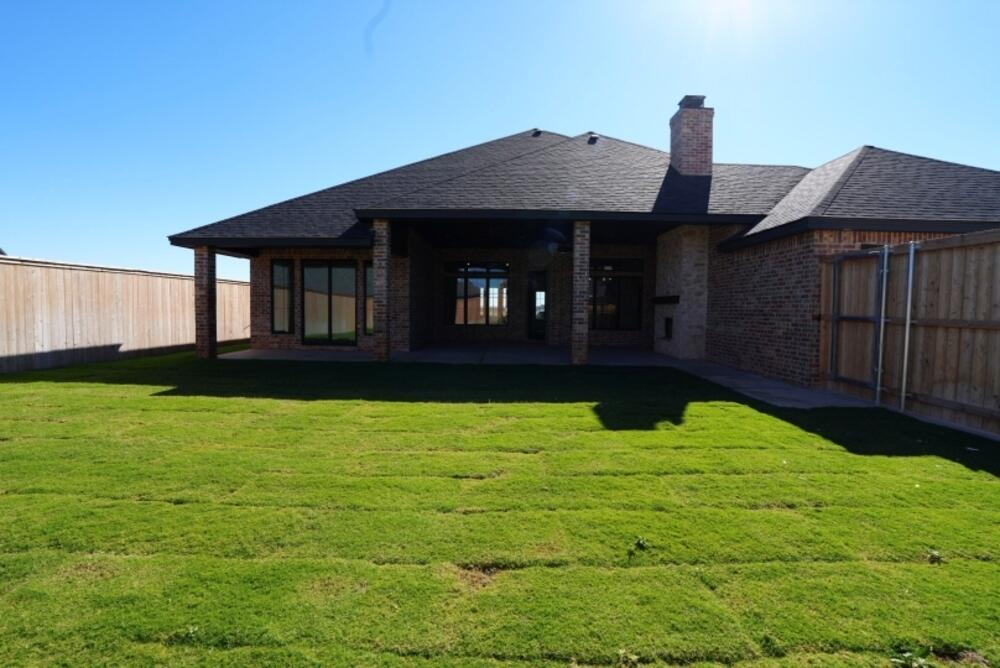 4620 143rd Street Lubbock, TX 79424 - Photo 23 of 25 a front view of a house with garden