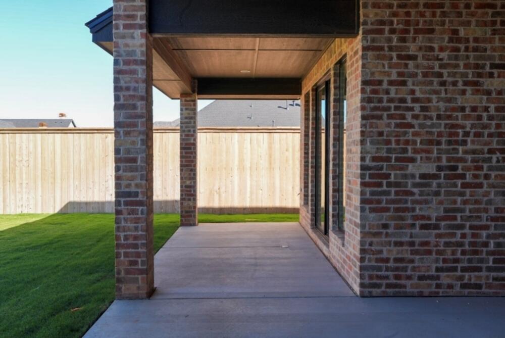 4620 143rd Street Lubbock, TX 79424 - Photo 24 of 25 a porch with seating space and garden view