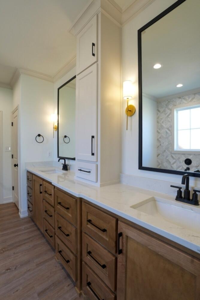 4620 143rd Street Lubbock, TX 79424 - Photo 5 of 25 a bathroom with a double vanity sink and a mirror
