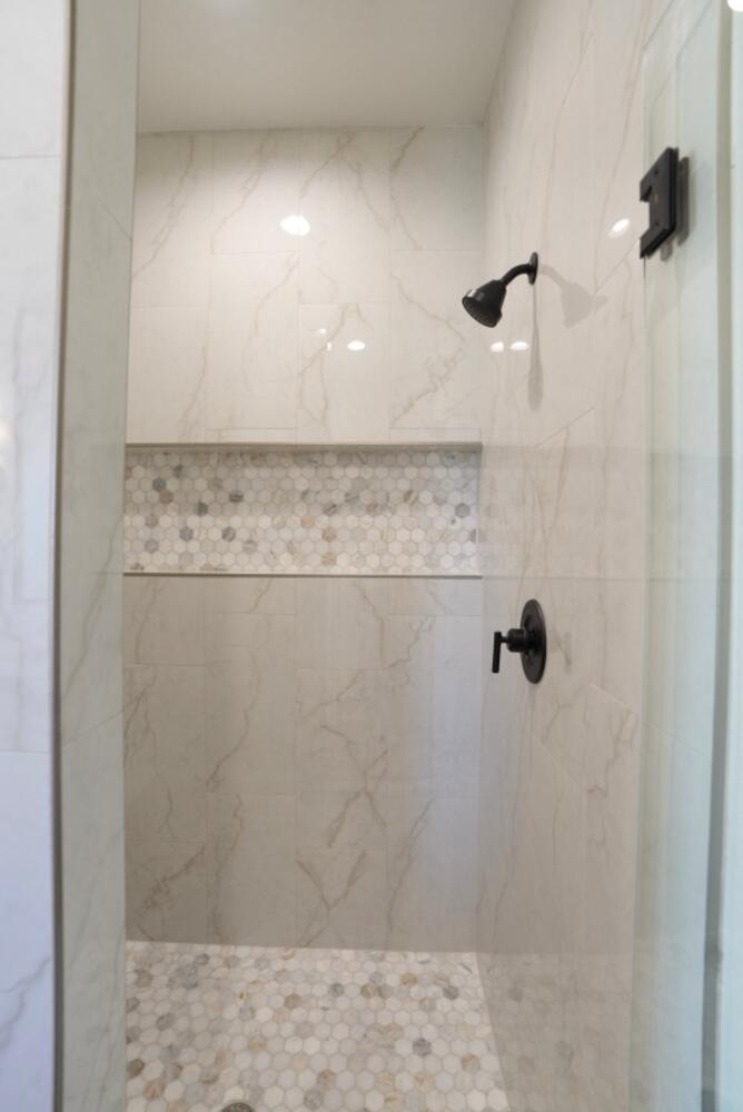 4620 143rd Street Lubbock, TX 79424 - Photo 7 of 25 a bathroom with a shower