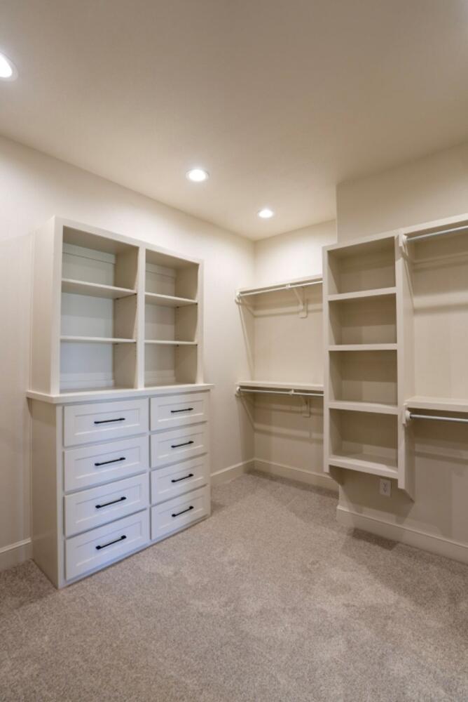 4620 143rd Street Lubbock, TX 79424 - Photo 8 of 25 a view of an empty room with a cabinet and mirrors