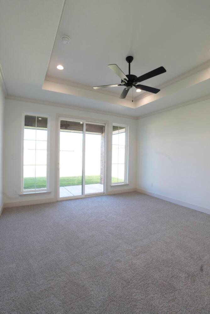 4620 143rd Street Lubbock, TX 79424 - Photo 10 of 25 a view of a livingroom with a ceiling fan and window