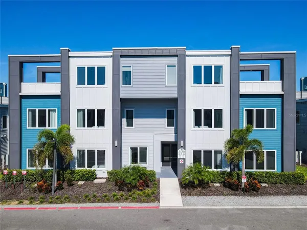 a front view of residential houses with street