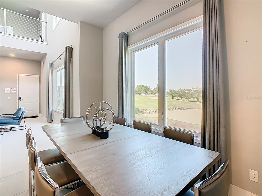 7740 Sandy Ridge Drive, Unit 245 Reunion, FL 34747 - Photo 11 of 57 a view of a dining room with furniture window and outside view