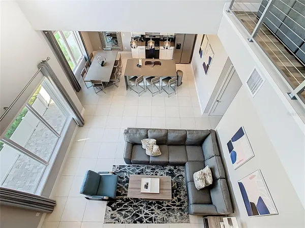 a view of a living room hardwood floor and a kitchen