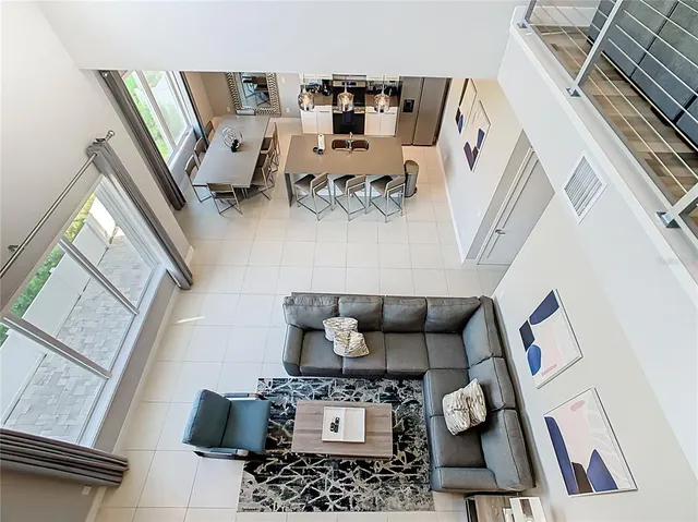 a view of a living room hardwood floor and a kitchen