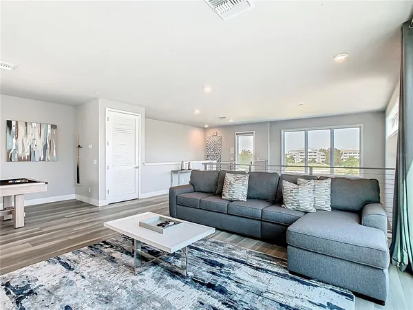 a bedroom with two beds and a large window