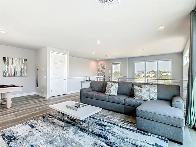 a bedroom with two beds and a large window