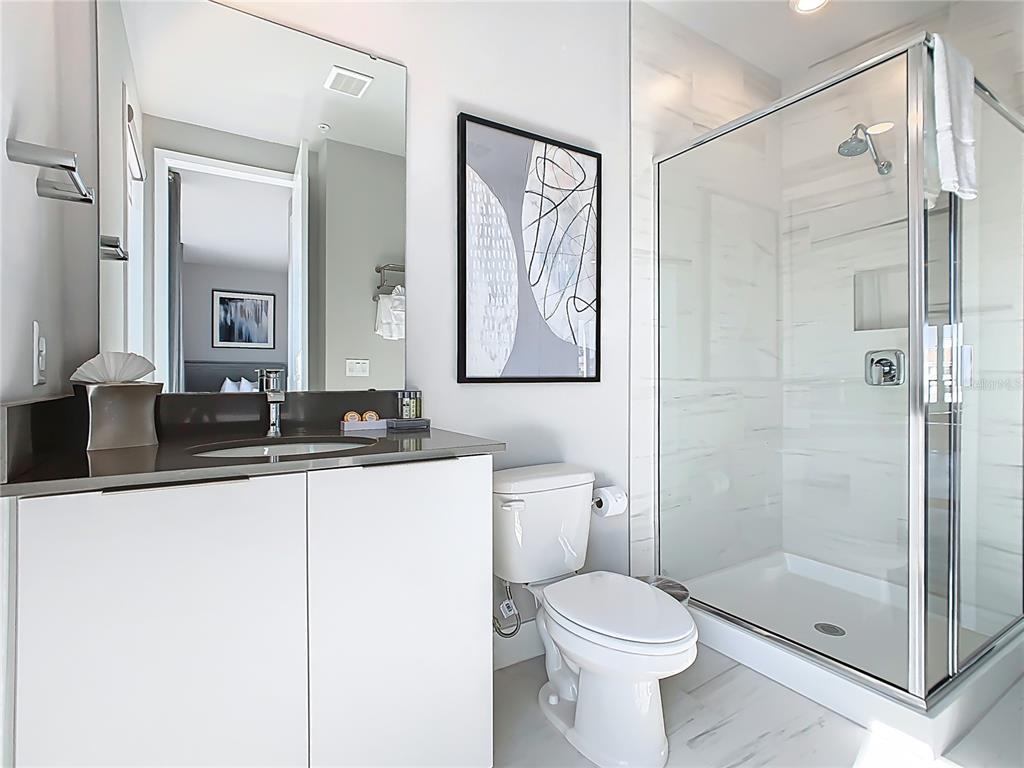 7740 Sandy Ridge Drive, Unit 245 Reunion, FL 34747 - Photo 29 of 57 a bathroom with a sink toilet and shower
