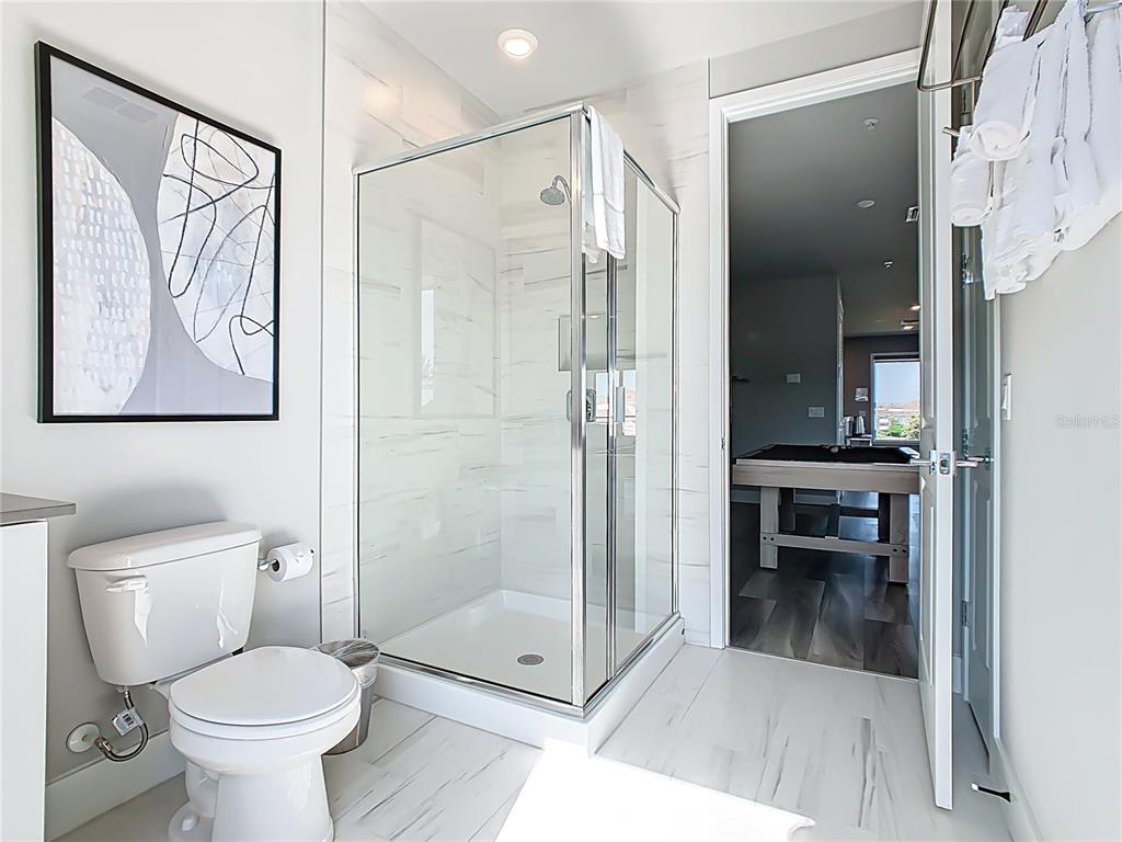 7740 Sandy Ridge Drive, Unit 245 Reunion, FL 34747 - Photo 30 of 57 a bathroom with a toilet and a shower