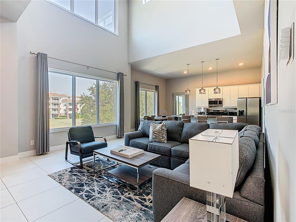 7740 Sandy Ridge Drive, Unit 245 Reunion, FL 34747 - Photo 3 of 57 a living room with furniture and a large window
