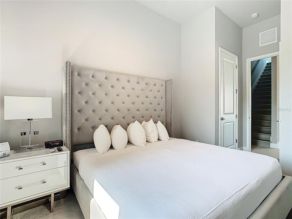 7740 Sandy Ridge Drive, Unit 245 Reunion, FL 34747 - Photo 33 of 57 a bedroom with a bed and window