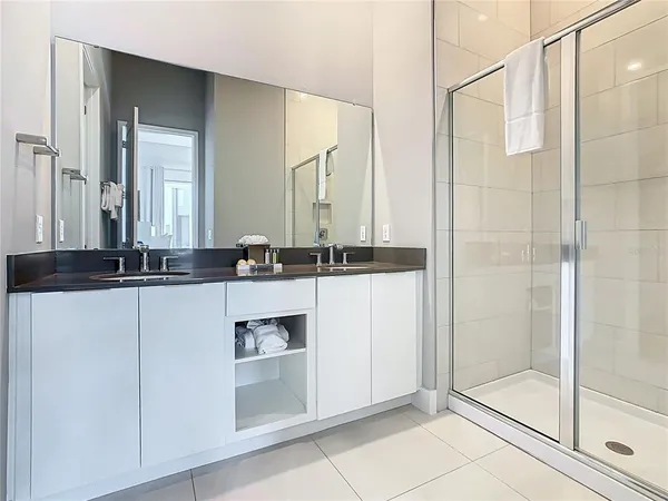 a bedroom with a bed and a night stand