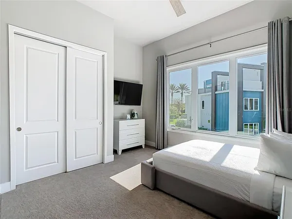 a bedroom with a bed and lamp